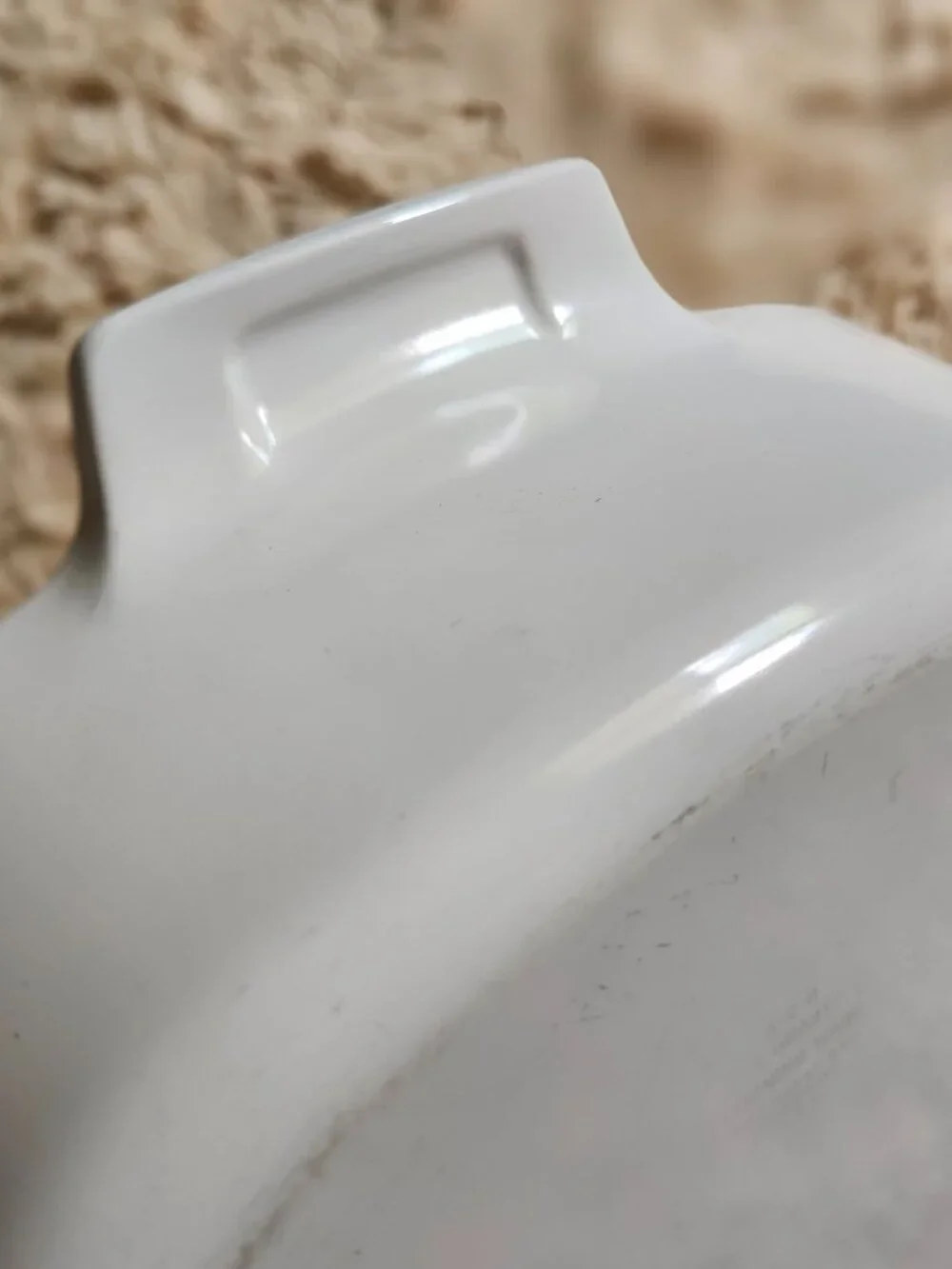 Three CorningWare casserole dishes with lids